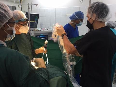 Surgeon and surgical team setting up for robotic assisted hysterectomy