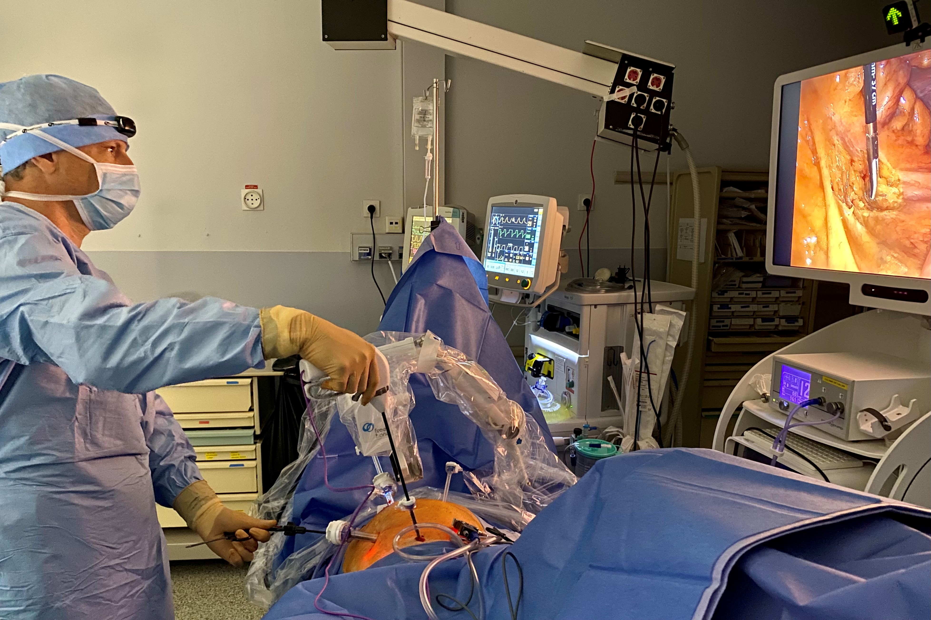 General surgeon performing a robot assisted left hemi colectomy surgery